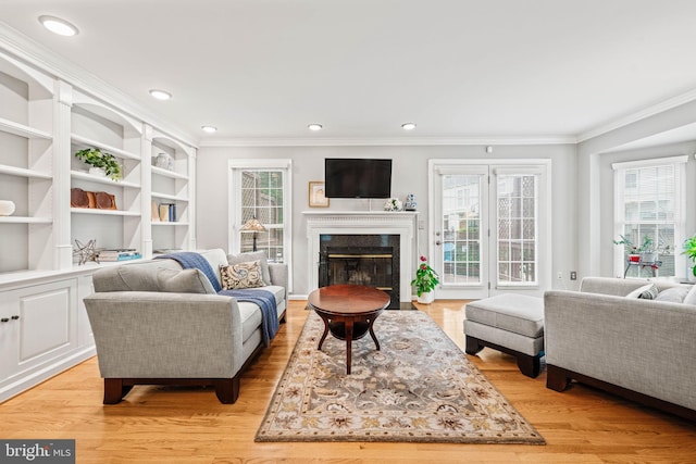 913 Rolfe Pl, Alexandria, VA 22314 - living room with crown molding, light wood-type flooring, a high end fireplace, and recessed lighting