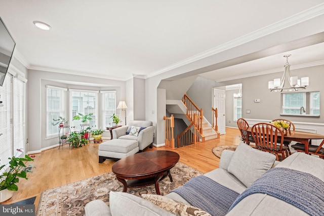 913 Rolfe Pl, Alexandria, VA 22314 - living area featuring stairs, a chandelier, light wood-type flooring, and crown molding