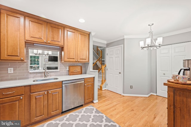 913 Rolfe Pl, Alexandria, VA 22314 - kitchen featuring dishwasher, a chandelier, brown cabinetry, light wood-style flooring, and tasteful backsplash