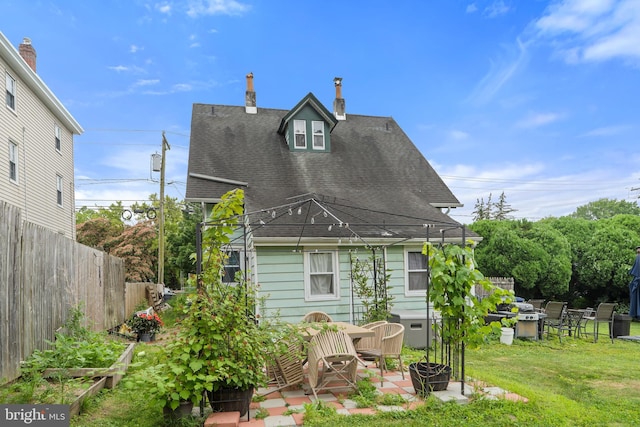 127 Schooley St, Moorestown, NJ 08057 - rear view of house featuring roof with shingles, a patio area, and a chimney