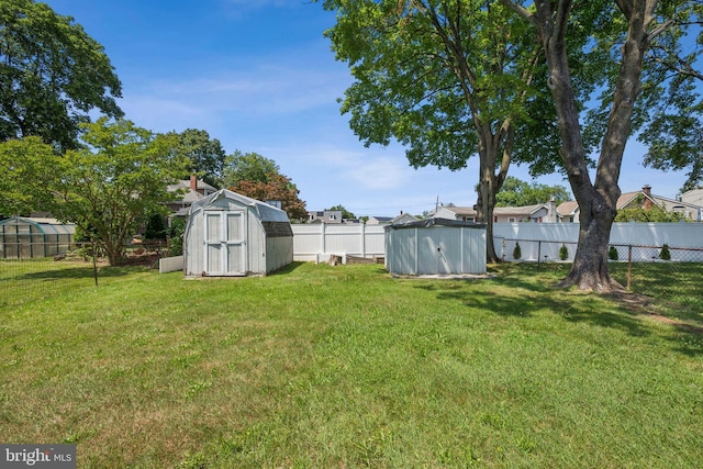 138 Morgan Ave, Hamilton, NJ 08619 - fenced backyard with a shed and an exterior structure