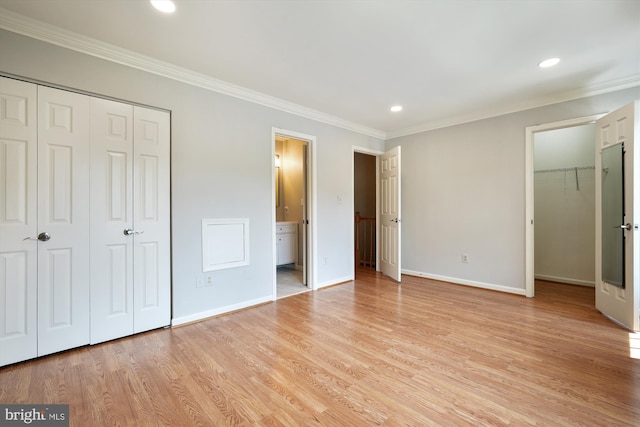 10 Suncroft Ct, Silver Spring, MD 20904 - unfurnished bedroom featuring a closet, ornamental molding, light wood-type flooring, recessed lighting, and ensuite bathroom