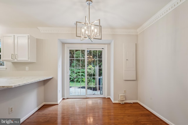 10 Suncroft Ct, Silver Spring, MD 20904 - unfurnished dining area featuring a chandelier, wood finished floors, ornamental molding, and electric panel