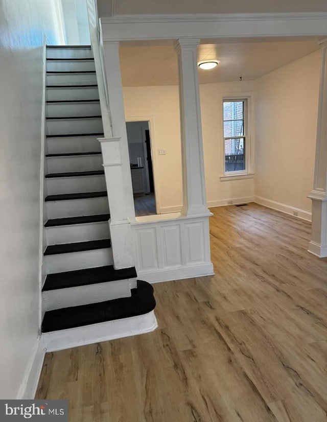 3433 E St, Philadelphia, PA 19134 - staircase featuring ornate columns and wood finished floors