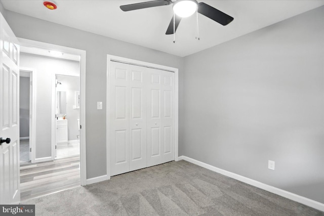 1415 Larch Rd, Severn, MD 21144 - unfurnished bedroom with carpet floors, a closet, and a ceiling fan
