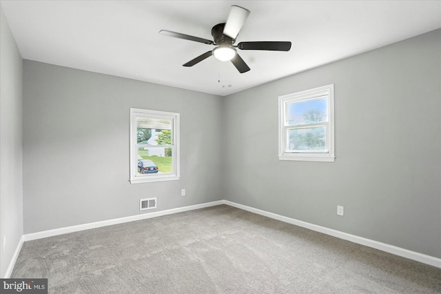 1415 Larch Rd, Severn, MD 21144 - carpeted empty room with healthy amount of natural light and ceiling fan