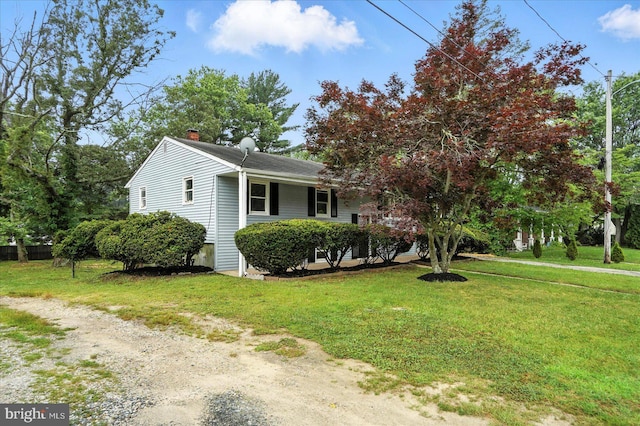 1415 Larch Rd, Severn, MD 21144 - view of front of property featuring a chimney and a front yard