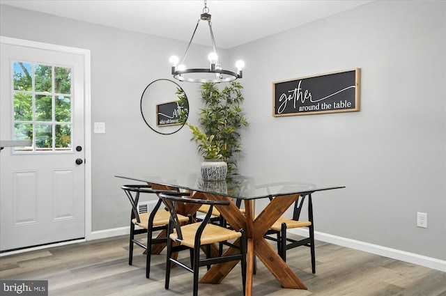 1415 Larch Rd, Severn, MD 21144 - dining area featuring a chandelier and light wood finished floors