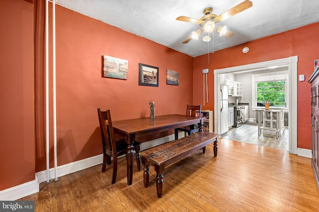 619 E 36th St E, Baltimore, MD 21218 - dining space featuring a ceiling fan and wood finished floors