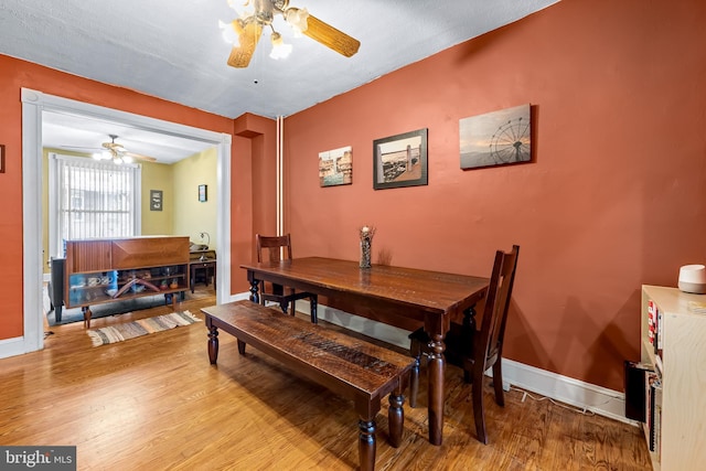 619 E 36th St E, Baltimore, MD 21218 - dining space with ceiling fan and wood finished floors