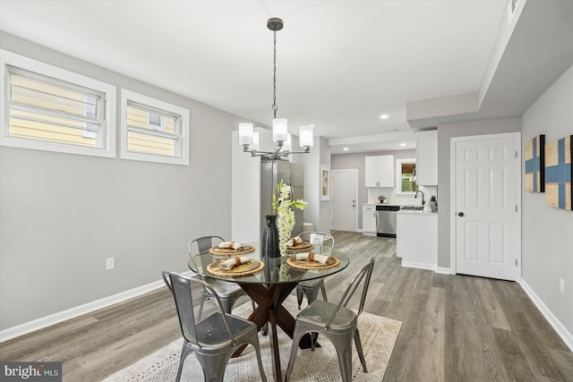 3912 Fernhill Ave, Baltimore, MD 21215 - dining area with a chandelier, light wood-type flooring, and recessed lighting