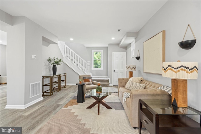 3912 Fernhill Ave, Baltimore, MD 21215 - living room with wood finished floors, stairs, and recessed lighting
