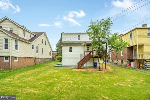 3912 Fernhill Ave, Baltimore, MD 21215 - rear view of property with stairs, a yard, and a deck
