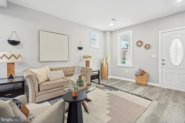 3912 Fernhill Ave, Baltimore, MD 21215 - living area featuring wood finished floors and recessed lighting