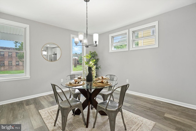 3912 Fernhill Ave, Baltimore, MD 21215 - dining area with a chandelier and wood finished floors