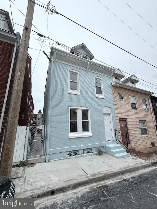 331 Spring Garden St, Reading, PA 19602 - view of property with brick siding and a gate