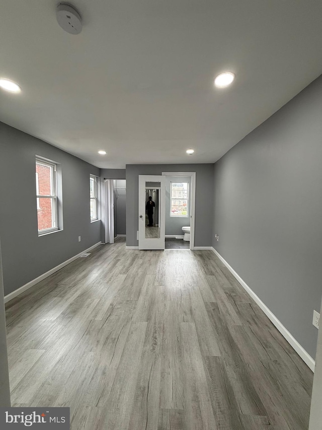 331 Spring Garden St, Reading, PA 19602 - unfurnished living room with recessed lighting, wood finished floors, and plenty of natural light