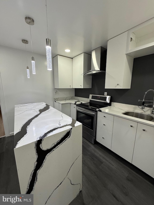 331 Spring Garden St, Reading, PA 19602 - kitchen with range hood, stainless steel electric stove, white cabinetry, dark wood finished floors, and decorative light fixtures