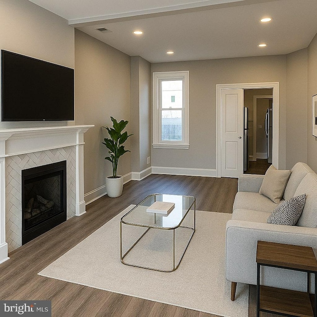 335 N 60th St, Philadelphia, PA 19139 - living room featuring dark wood finished floors, recessed lighting, and a fireplace