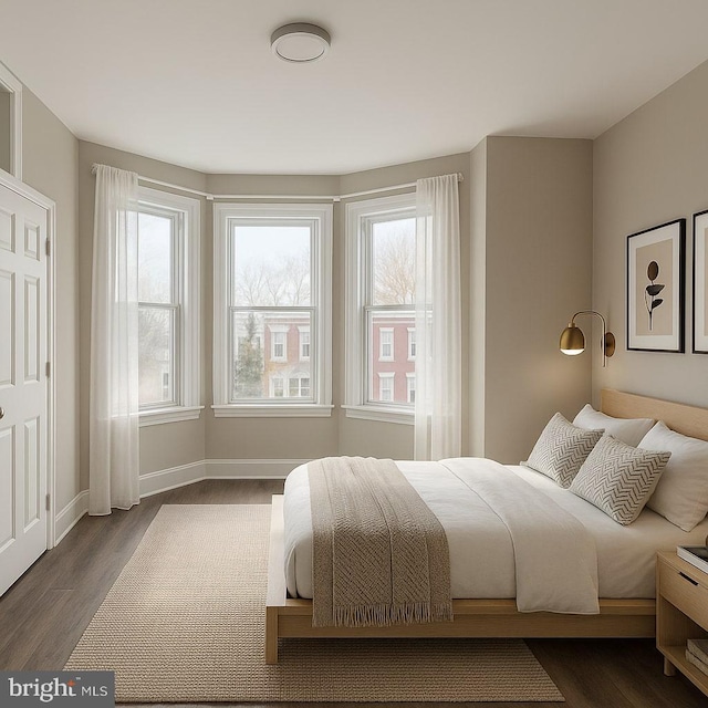 335 N 60th St, Philadelphia, PA 19139 - bedroom featuring baseboards and dark wood finished floors