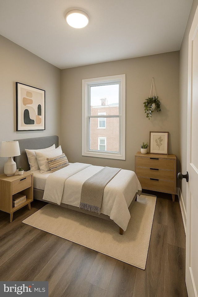 335 N 60th St, Philadelphia, PA 19139 - bedroom featuring dark wood-style floors and baseboards