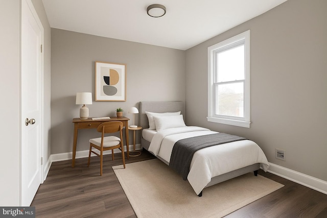 335 N 60th St, Philadelphia, PA 19139 - bedroom with baseboards and dark wood finished floors