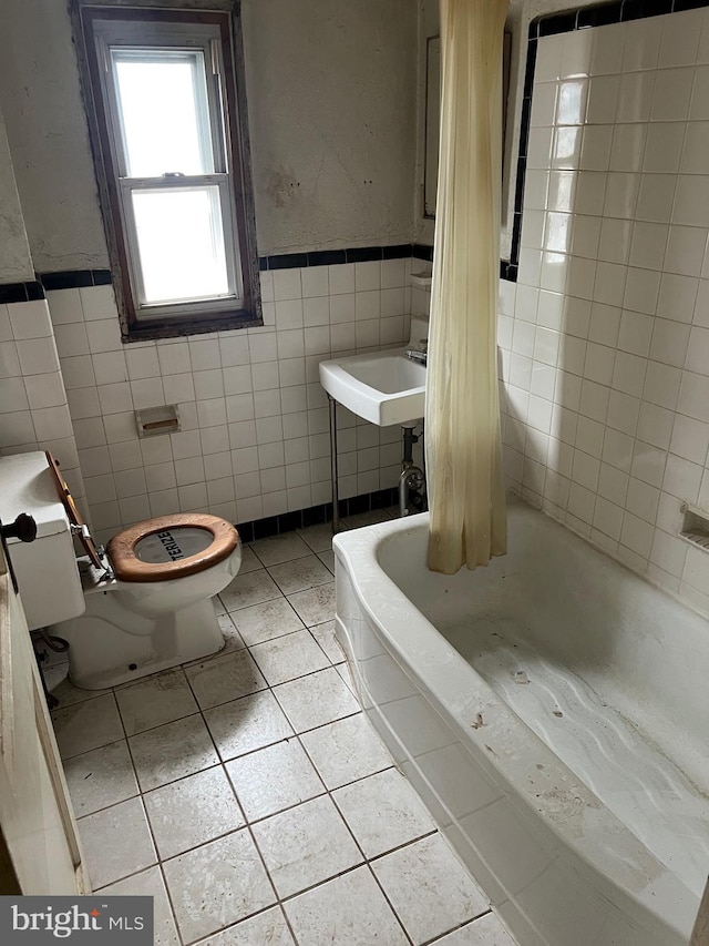 1002 Agnew Dr Unit 1, Drexel Hill, PA 19026 - bathroom with tile walls, tile patterned flooring, and a wainscoted wall