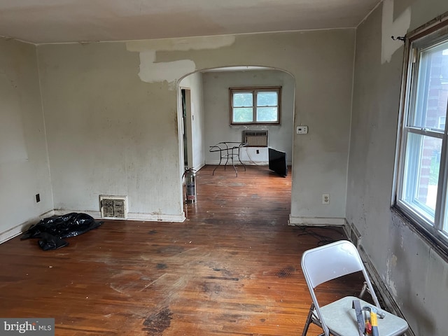 1002 Agnew Dr Unit 1, Drexel Hill, PA 19026 - empty room featuring arched walkways, hardwood / wood-style flooring, and a wall mounted air conditioner