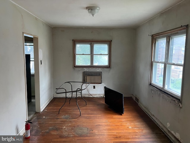 1002 Agnew Dr Unit 1, Drexel Hill, PA 19026 - unfurnished room featuring an AC wall unit and wood finished floors