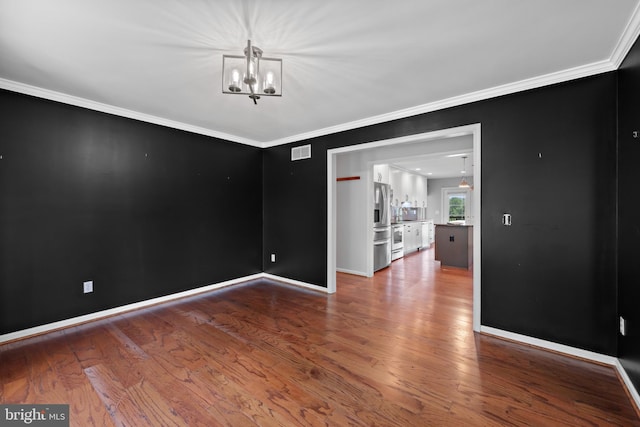 20 Bee Tree Mill Ct, Parkton, MD 21120 - empty room with a chandelier, ornamental molding, and wood finished floors