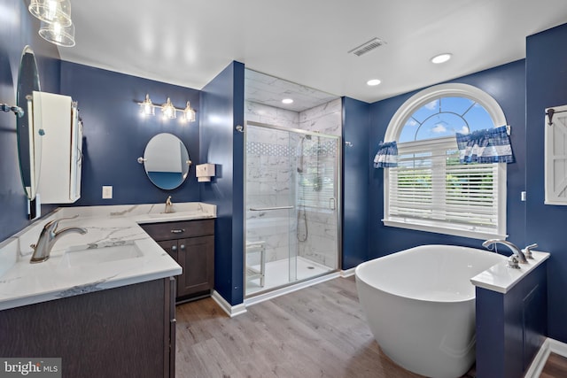 20 Bee Tree Mill Ct, Parkton, MD 21120 - full bath featuring double vanity, a soaking tub, wood finished floors, a stall shower, and recessed lighting