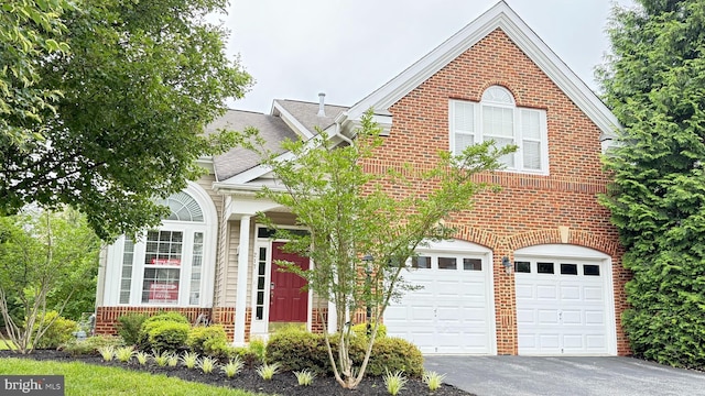 217 Smarty Jones Ter, Havre De Grace, MD 21078 - view of front of property featuring brick siding, a garage, driveway, and a shingled roof
