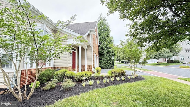 217 Smarty Jones Ter, Havre De Grace, MD 21078 - view of property exterior featuring brick siding, a lawn, and roof with shingles