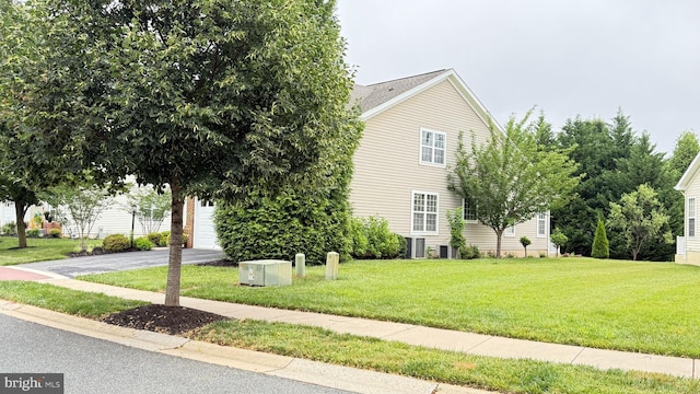 217 Smarty Jones Ter, Havre De Grace, MD 21078 - view of front facade featuring a front lawn, asphalt driveway, and a garage