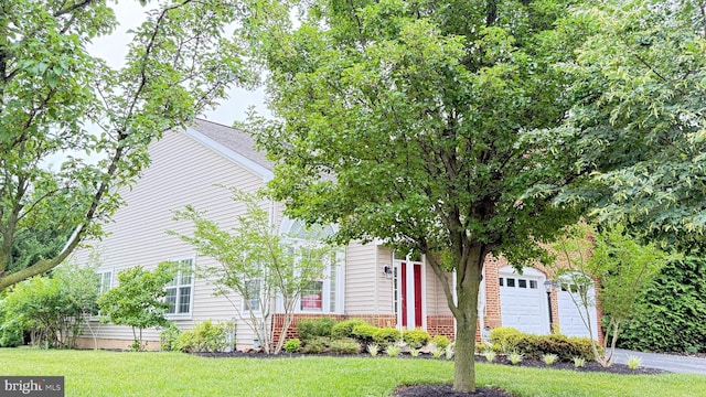 217 Smarty Jones Ter, Havre De Grace, MD 21078 - view of property hidden behind natural elements with a front lawn, a garage, and driveway