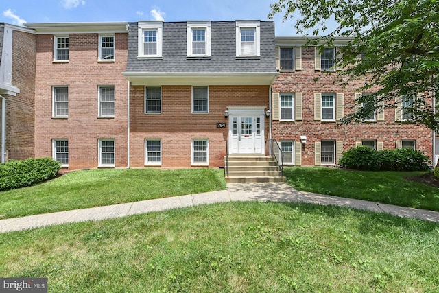 784 Quince Orchard Blvd Unit T1, Gaithersburg, MD 20878 - view of front of property featuring mansard roof, a shingled roof, a front yard, and brick siding