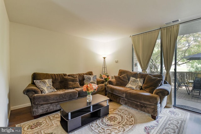 784 Quince Orchard Blvd Unit T1, Gaithersburg, MD 20878 - living area featuring wood finished floors and baseboards