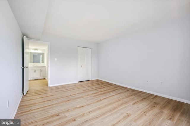 1836 Metzerott Rd Unit 419, Hyattsville, MD 20783 - unfurnished bedroom featuring light wood-style floors and a closet