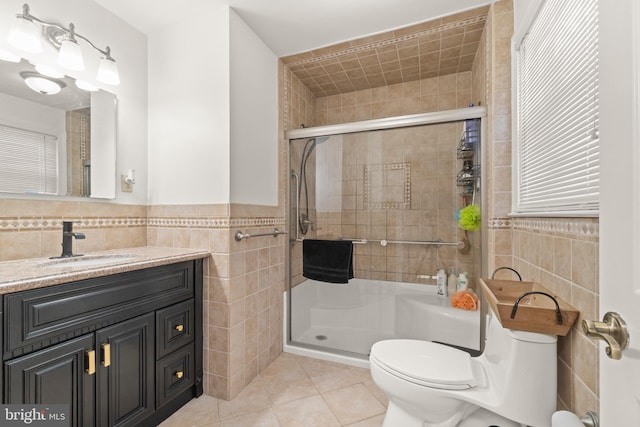 405 Frances Ave, Linwood, NJ 08221 - bathroom featuring tile walls, a shower stall, tile patterned flooring, vanity, and a wainscoted wall