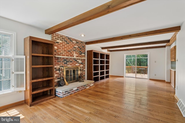 213 Willits Way, Glen Mills, PA 19342 - unfurnished living room featuring hardwood / wood-style floors, a brick fireplace, and beamed ceiling