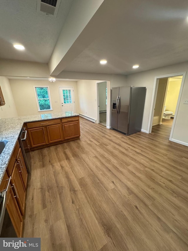 5825 Ebenezer Rd, White Marsh, MD 21162 - kitchen featuring stainless steel refrigerator with ice dispenser, a baseboard heating unit, recessed lighting, brown cabinets, and light wood-type flooring