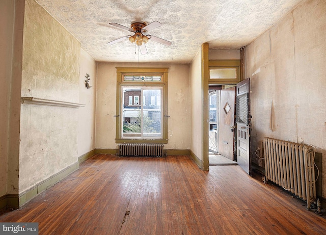 1626 N Smallwood St, Baltimore, MD 21216 - entrance foyer featuring radiator heating unit, hardwood / wood-style flooring, and ceiling fan