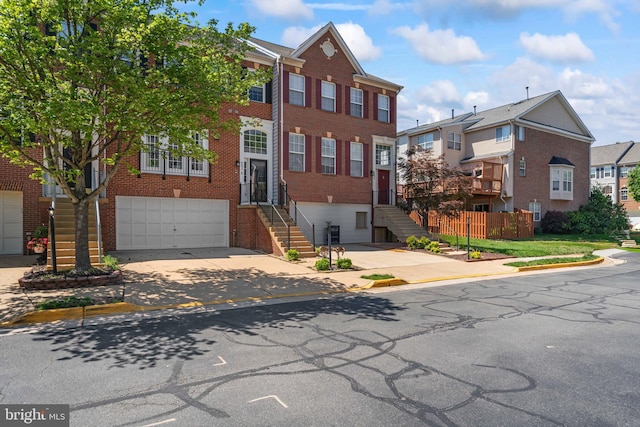 6692 Ordsall St, Alexandria, VA 22315 - multi unit property with brick siding, driveway, an attached garage, and a residential view