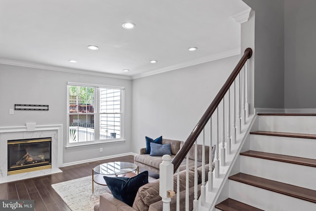 6692 Ordsall St, Alexandria, VA 22315 - living area with wood finished floors, crown molding, a fireplace, recessed lighting, and stairs