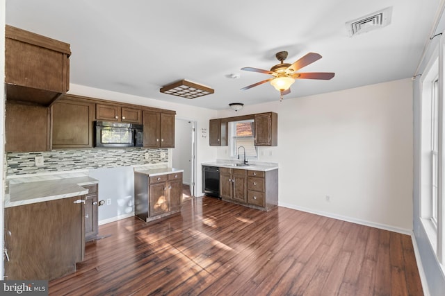 12 Orchard St, Keansburg, NJ 07734 - kitchen with black appliances, ceiling fan, tasteful backsplash, dark wood-style floors, and light countertops