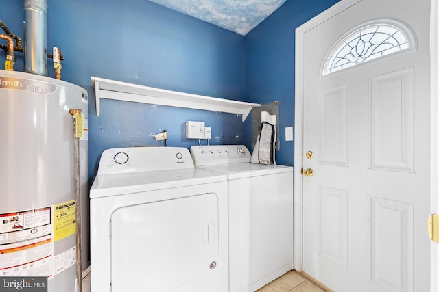 12 Orchard St, Keansburg, NJ 07734 - washroom with gas water heater, washing machine and dryer, and light tile patterned flooring