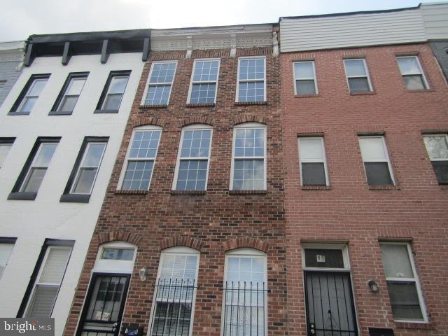 16 Gilmor St, Baltimore, MD 21223 - view of front of property with brick siding