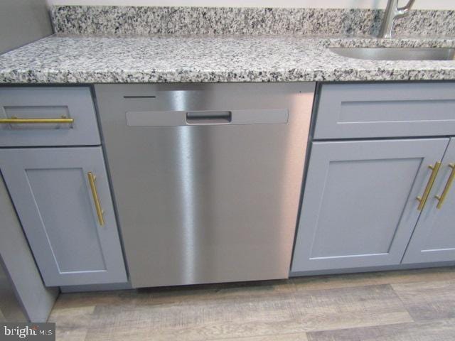 16 Gilmor St, Baltimore, MD 21223 - detailed view of stainless steel dishwasher and a sink