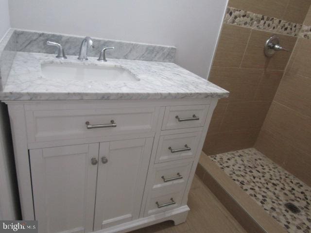 16 Gilmor St, Baltimore, MD 21223 - full bathroom with tiled shower and vanity