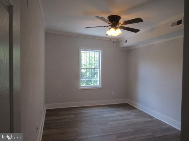 16 Gilmor St, Baltimore, MD 21223 - spare room featuring dark wood-style floors, ceiling fan, and crown molding